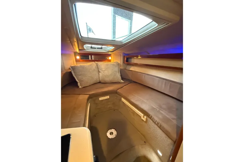 Slide: The Image of Interior cabin of 2010 Sea Ray Sundancer 280 with cozy seating and skylight. - 12