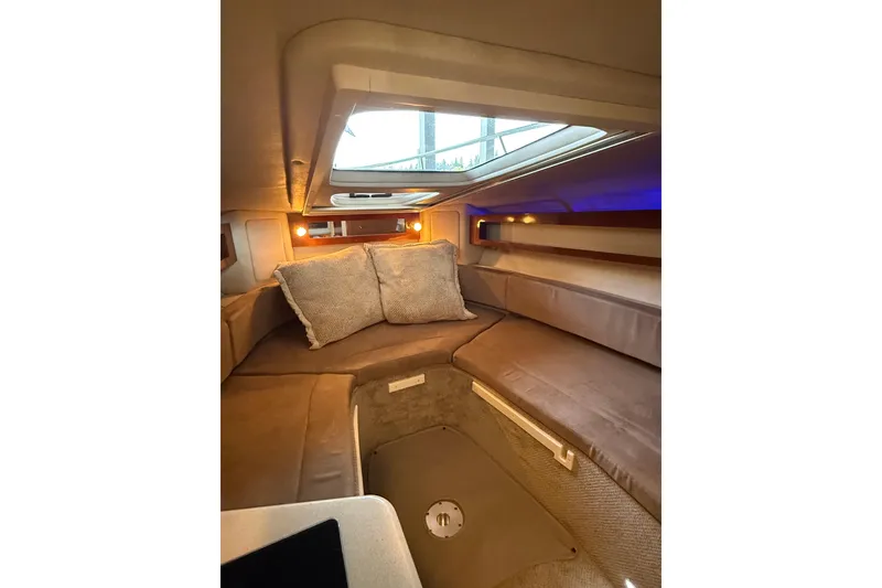 Slide: The Image of Interior cabin of 2010 Sea Ray Sundancer 280 with cozy seating and cushions. - 14
