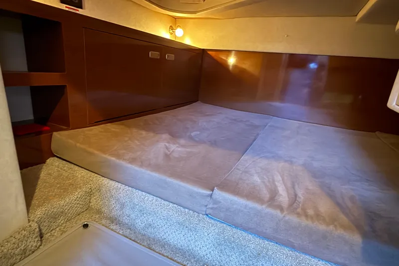 Slide: The Image of Interior cabin of 2010 Sea Ray Sundancer 280 with cozy sleeping area. - 15