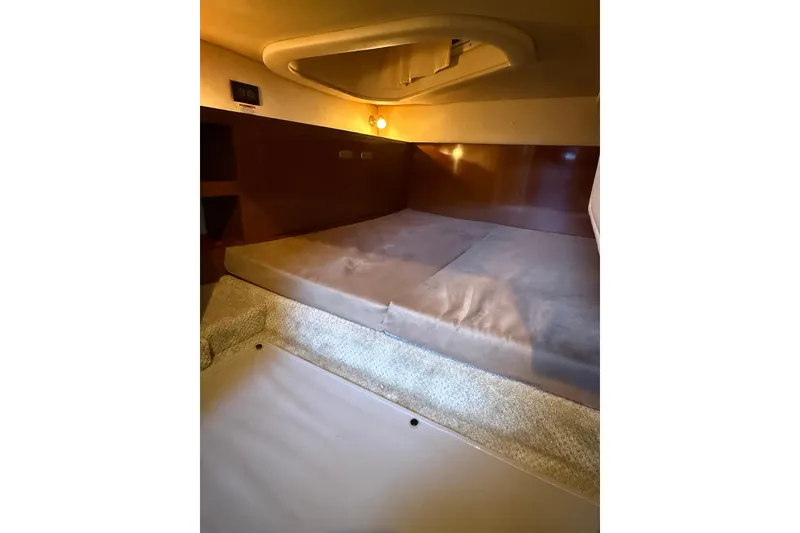 Slide: The Image of Interior cabin of 2010 Sea Ray Sundancer 280 with cozy sleeping area. - 16