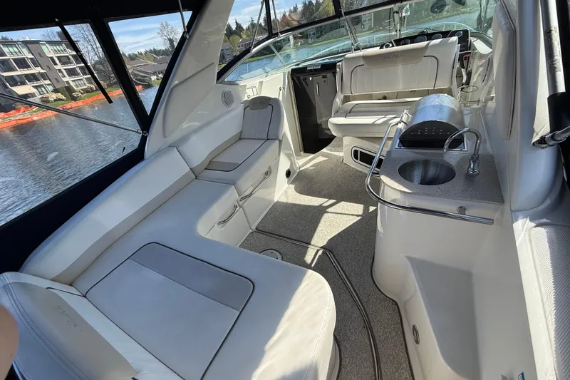 Slide: The Image of Interior of 2010 Sea Ray Sundancer 280 yacht with seating and kitchenette. - 21