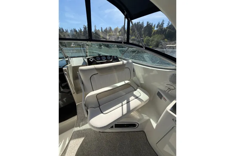 Slide: The Image of Interior view of 2010 Sea Ray Sundancer 280 boat with helm seat and dashboard. - 25