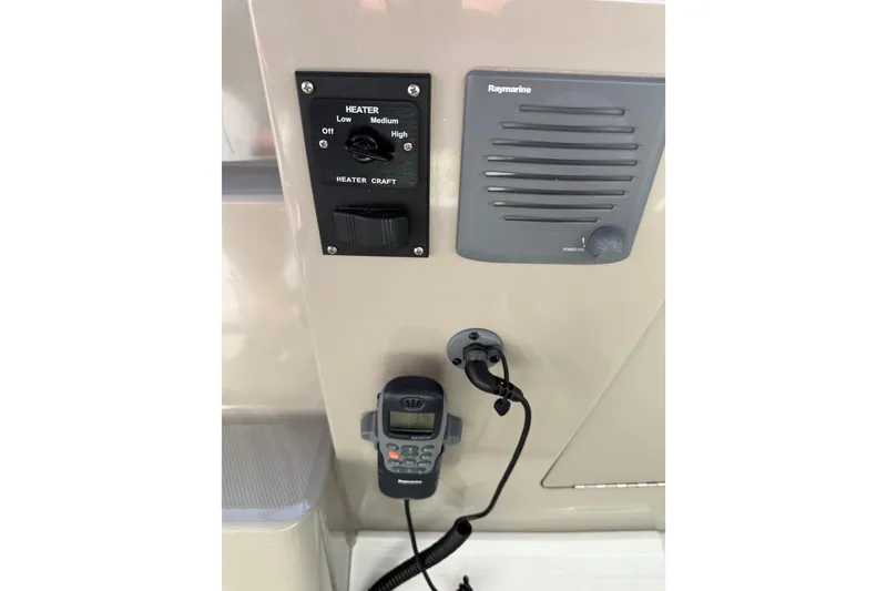 Slide: The Image of Control panel on 2010 Sea Ray Sundancer 280 with heater and Raymarine equipment. - 29