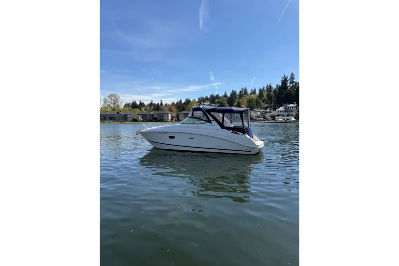 Slide: The Image of 2010 Sea Ray Sundancer 280 yacht on stands in a marina setting. - 32