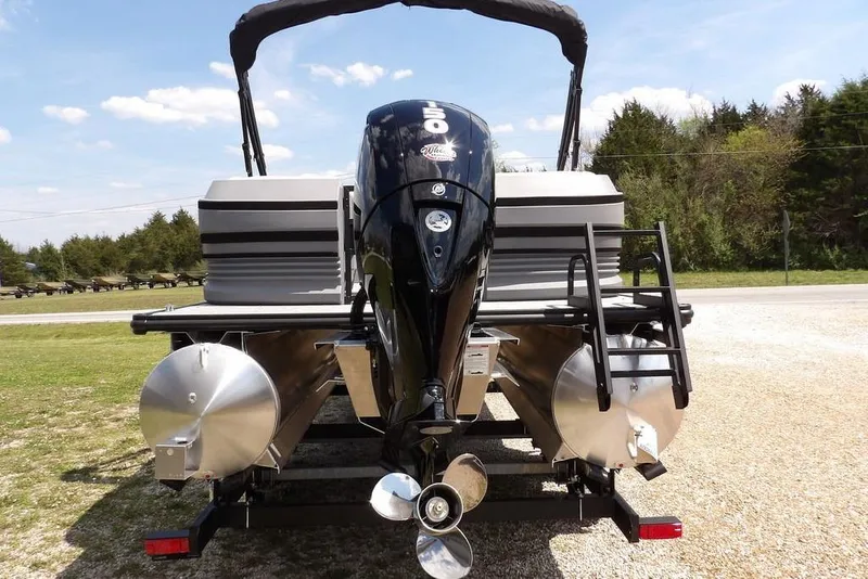 Slide: The Image of 2026 Sylvan R-22 LZ DH pontoon boat with powerful outboard motor, rear view. - 11