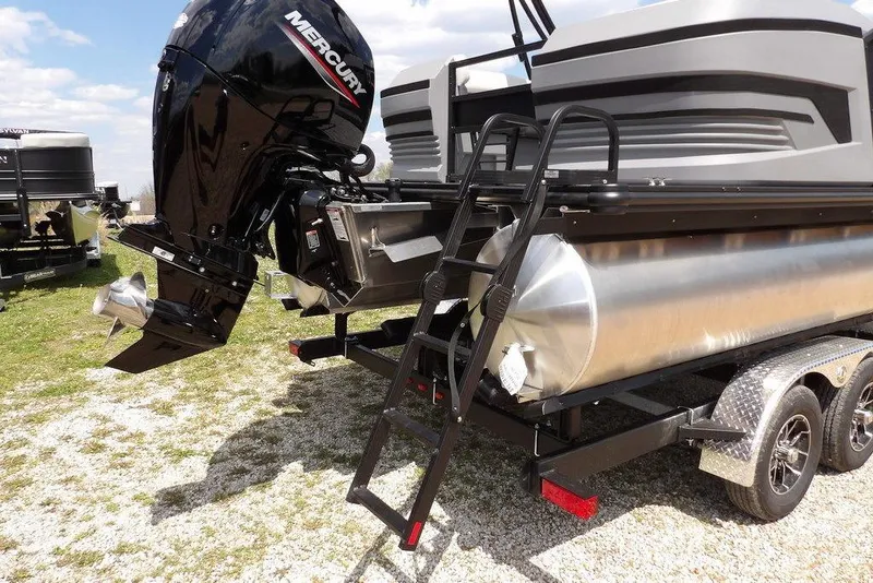 Slide: The Image of 2026 Sylvan R-22 LZ DH pontoon boat with Mercury outboard motor on trailer. - 12