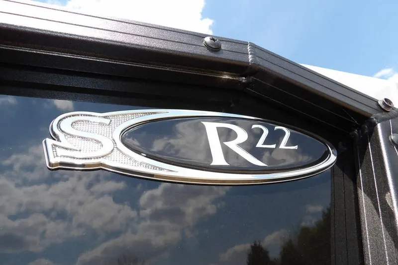 Slide: The Image of Close-up of Sylvan R-22 LZ DH 2026 model emblem against a blue sky. - 20