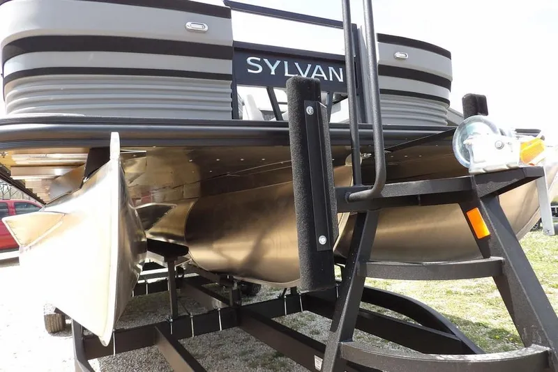 Slide: The Image of 2026 Sylvan R-22 LZ DH pontoon boat on trailer, showcasing sleek design and sturdy construction. - 23