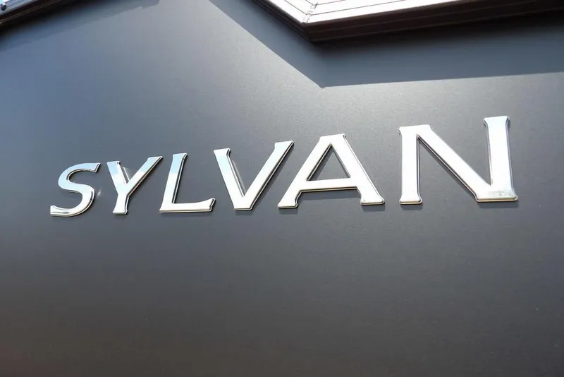 Slide: The Image of Sylvan logo on 2026 R-22 LZ DH model, metallic lettering on dark background. - 26
