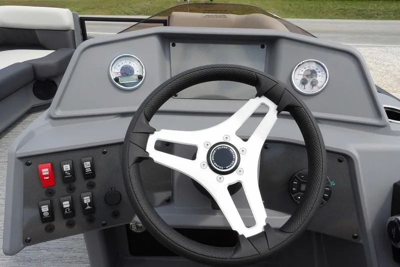 Slide: The Image of Steering console of 2026 Sylvan R-22 LZ DH boat with gauges and controls. - 28