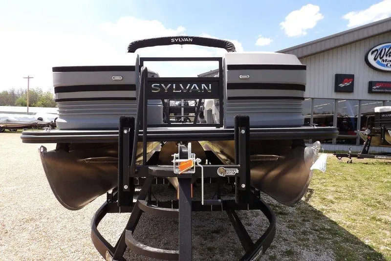 Slide: The Image of 2026 Sylvan R-22 LZ DH pontoon boat on trailer, displayed outdoors. - 3