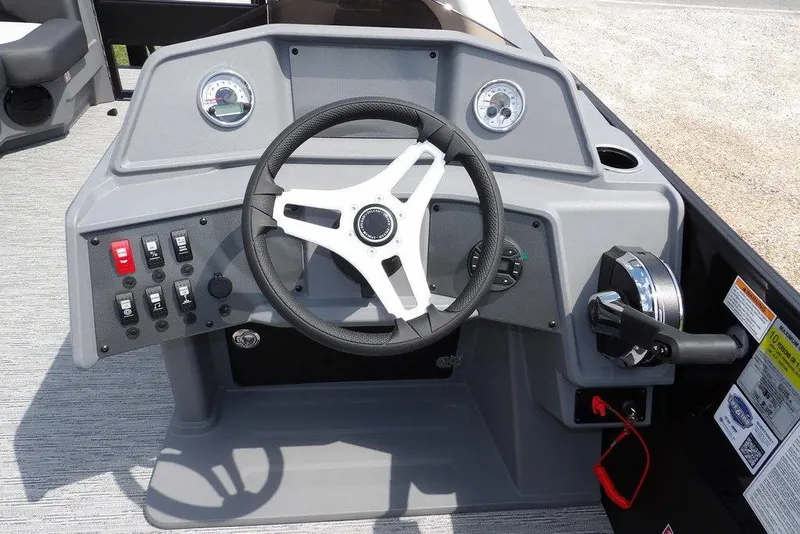 Slide: The Image of Steering console of 2026 Sylvan R-22 LZ DH boat with gauges and controls. - 30