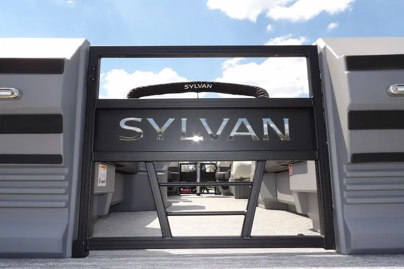 Slide: The Image of 2026 Sylvan R-22 LZ DH pontoon boat interior with logo and seating. - 34