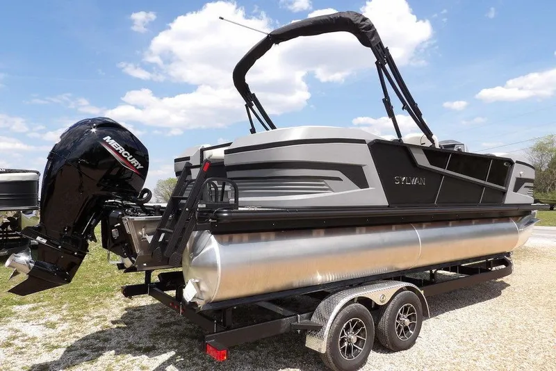 Slide: The Image of 2026 Sylvan R-22 LZ DH pontoon boat with Mercury outboard motor on trailer. - 7