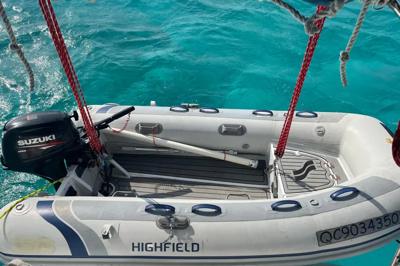 Slide: The Image of Inflatable boat with Suzuki motor on turquoise water, Hunter 410, 2002 model. - 19