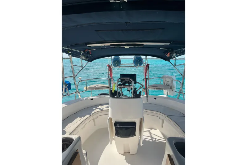 Slide: The Image of Cockpit view of 2002 Hunter 410 sailboat on clear blue water. - 20