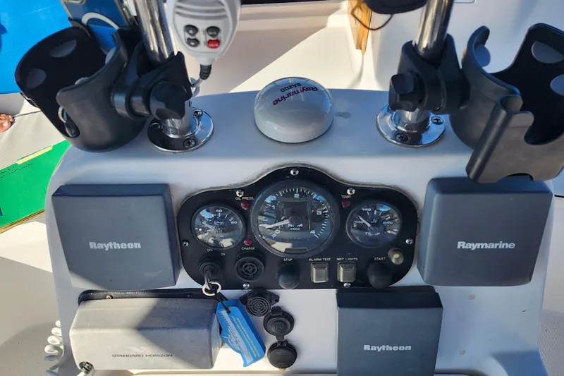 Slide: The Image of Control panel of a 2002 Hunter 410 sailboat with Raytheon and Raymarine equipment. - 30
