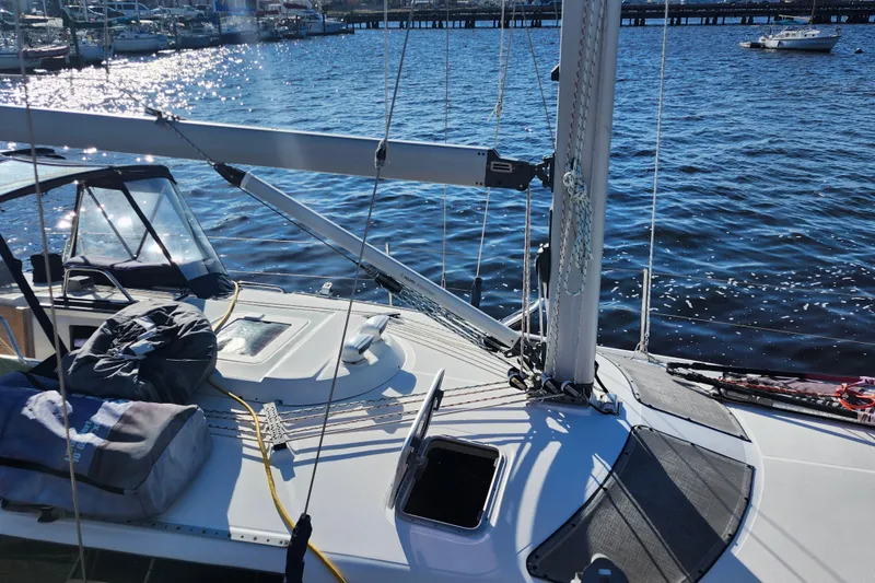 Slide: The Image of Sailboat deck view on water, Hunter 410 model, 2002, with marina background. - 33