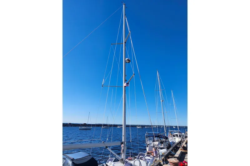 Slide: The Image of Sailboat docked at marina, Hunter 410 model, 2002, under clear blue sky. - 34