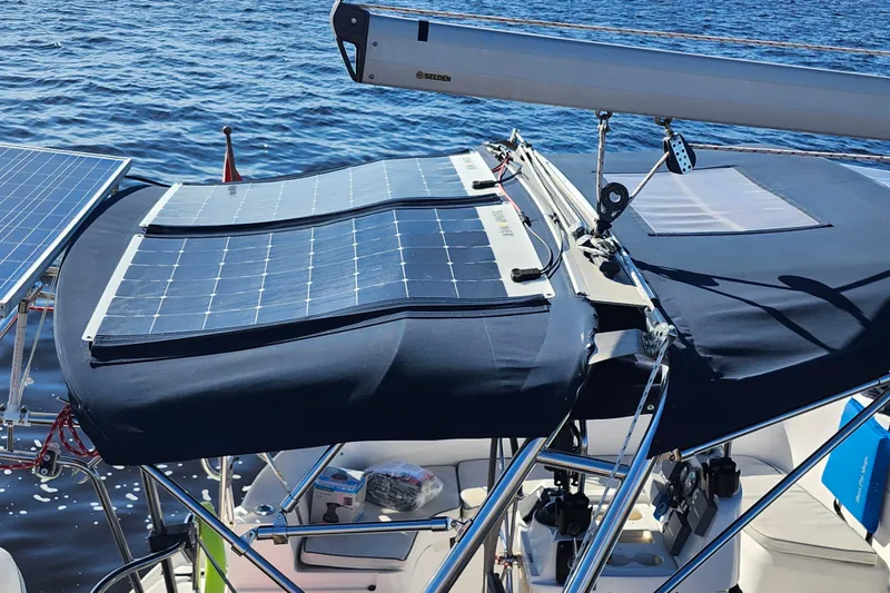 Slide: The Image of Hunter 410 sailboat with solar panels on deck, 2002 model, on a sunny day at sea. - 35