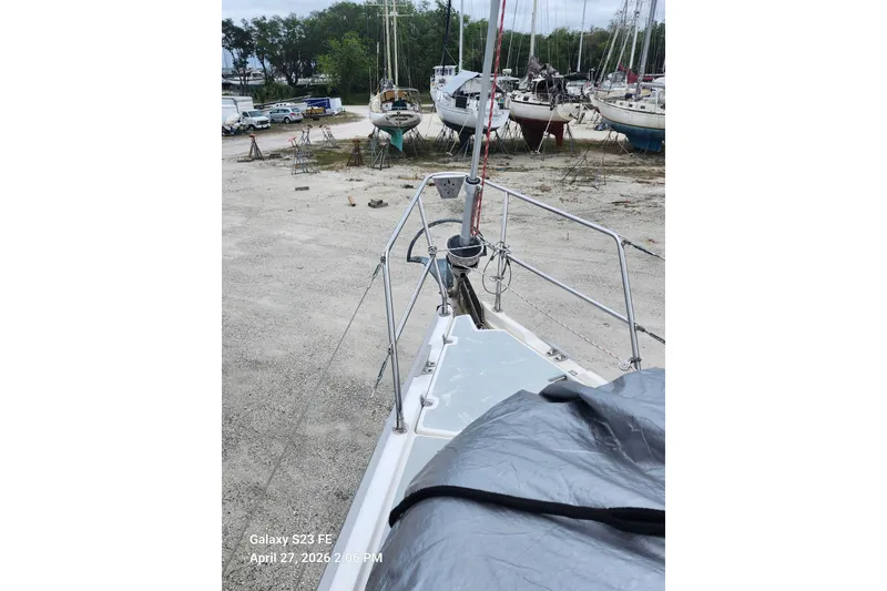 Slide: The Image of Bow view of a 2002 Hunter 410 sailboat in a boatyard. - 42