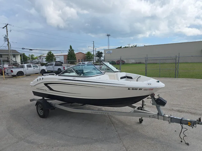 Slide: The Image of 2016 Chaparral 18 H2O Sport boat on trailer in parking lot. - 6