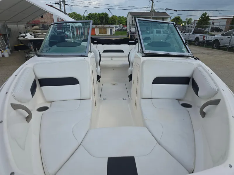 Slide: The Image of 2016 Chaparral 18 H2O Sport boat interior with white seating and windshield. - 7