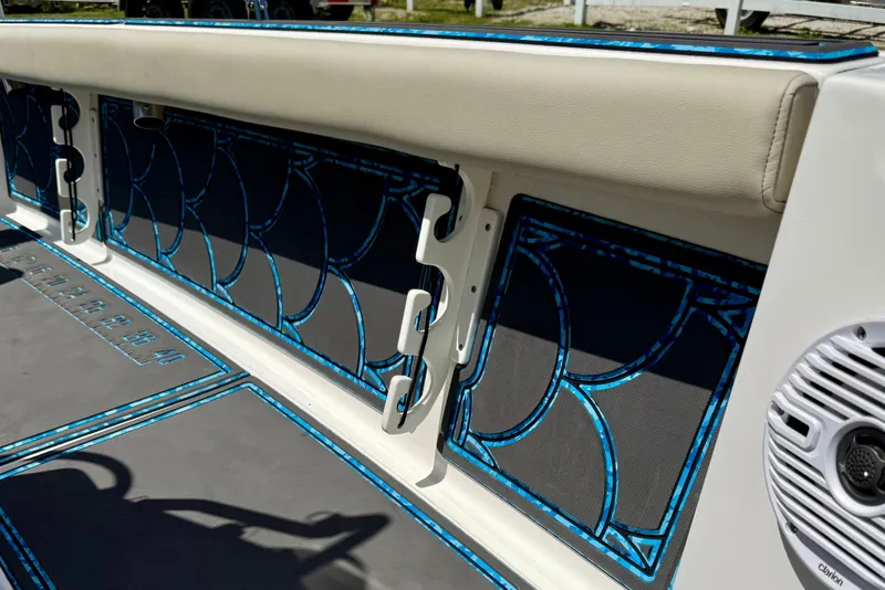 Slide: The Image of 2023 Key West 188 Bay Reef boat interior with blue accents and speaker system. - 14