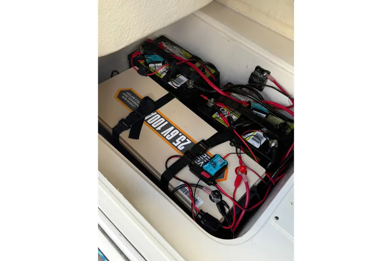 Slide: The Image of Battery compartment of 2023 Key West 188 Bay Reef boat with wiring and connections. - 22