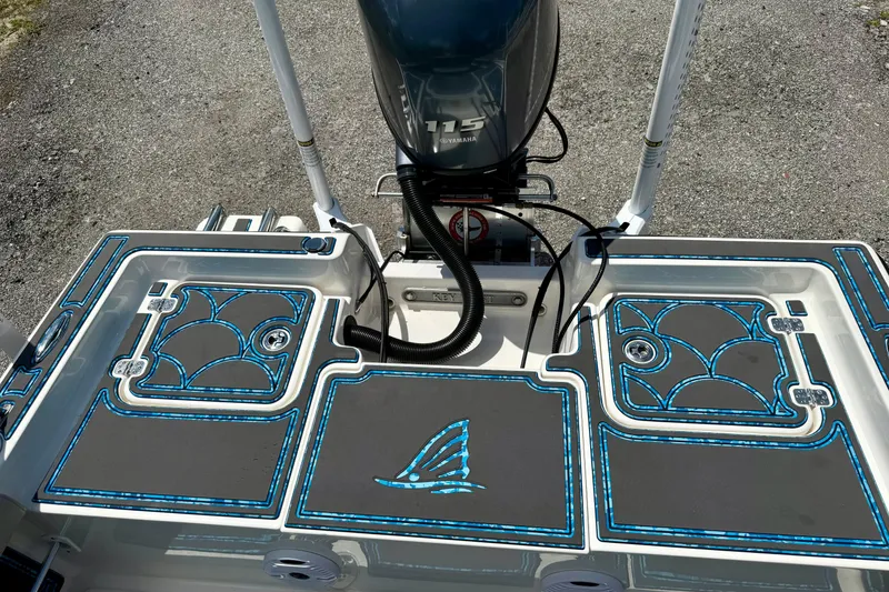 Slide: The Image of 2023 Key West 188 Bay Reef boat deck with blue accents and Yamaha motor. - 26