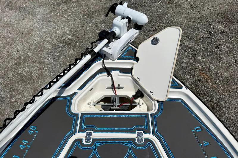 Slide: The Image of 2023 Key West 188 Bay Reef boat deck with open hatch and trolling motor. - 9