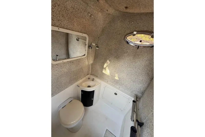Slide: The Image of Propellers of a 2007 Wellcraft 35 Scarab Sport Open boat in a parking lot. - 10