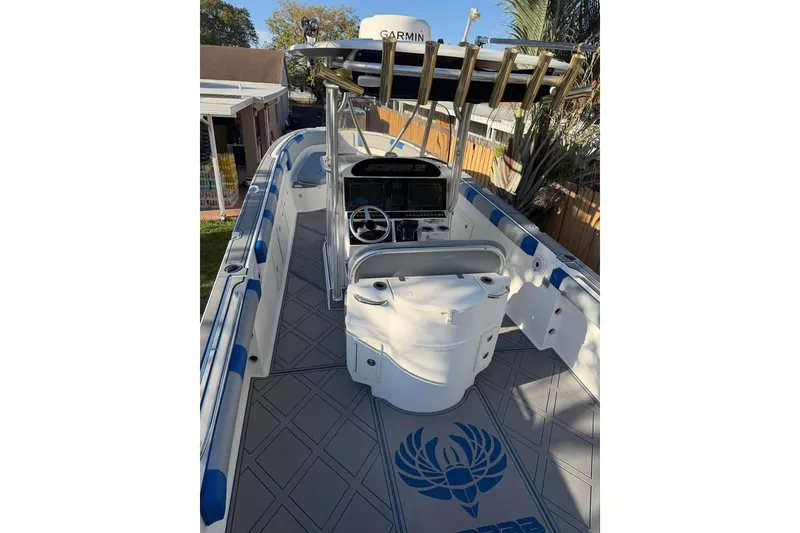 Slide: The Image of Triple Verado 350 engines on a 2007 Wellcraft 35 Scarab Sport Open under a blue sky. - 5