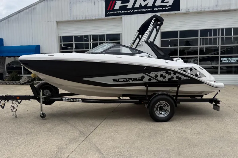 The Image of 2017 Scarab 195 H.O. boat on trailer outside Hartmann Marine Group building. - 1
