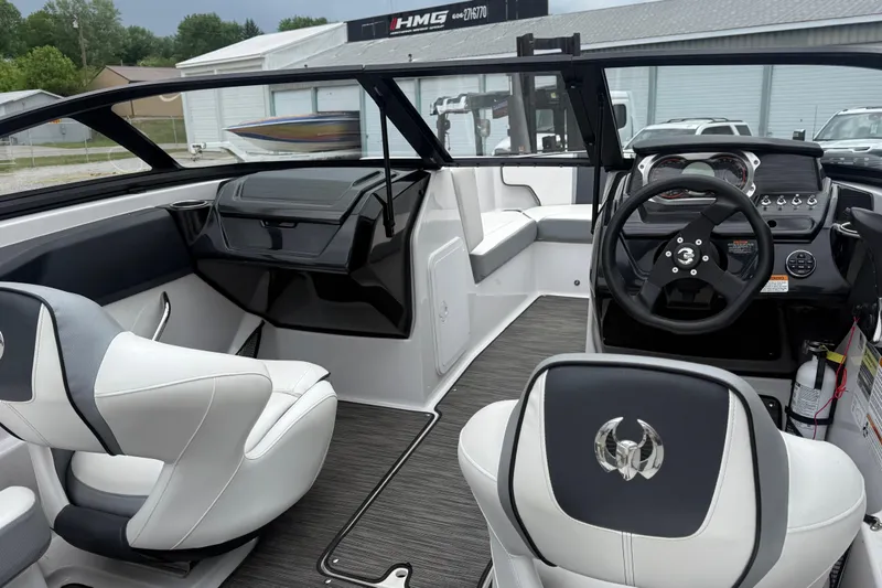 Slide: The Image of Interior of a 2017 Scarab 195 H.O. boat with modern dashboard and seating. - 8