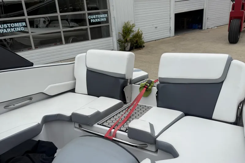 Slide: The Image of Interior of a 2017 Scarab 195 H.O. boat with white and gray seating. - 9