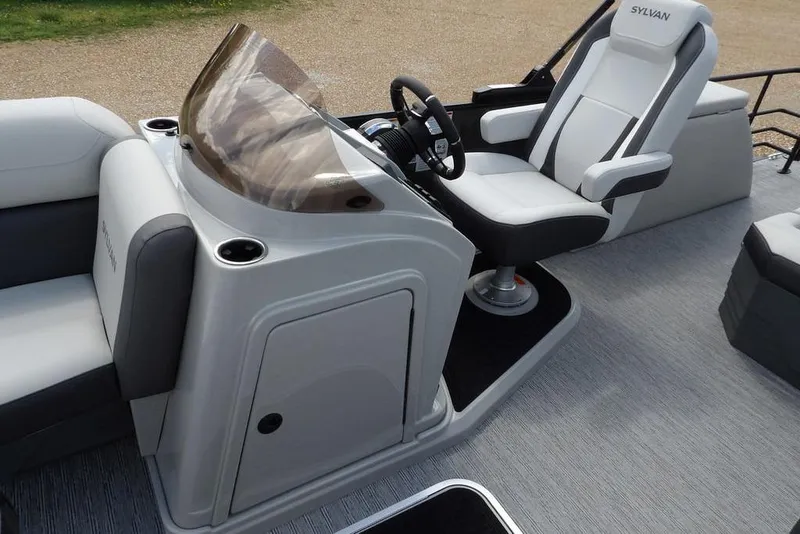 Slide: The Image of 2026 Sylvan X3 CLZ DH boat interior with sleek helm and comfortable seating. - 16