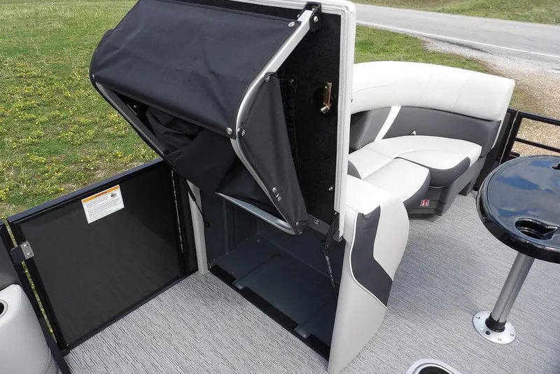 Slide: The Image of 2026 Sylvan X3 CLZ DH pontoon boat interior with seating and storage compartment. - 19
