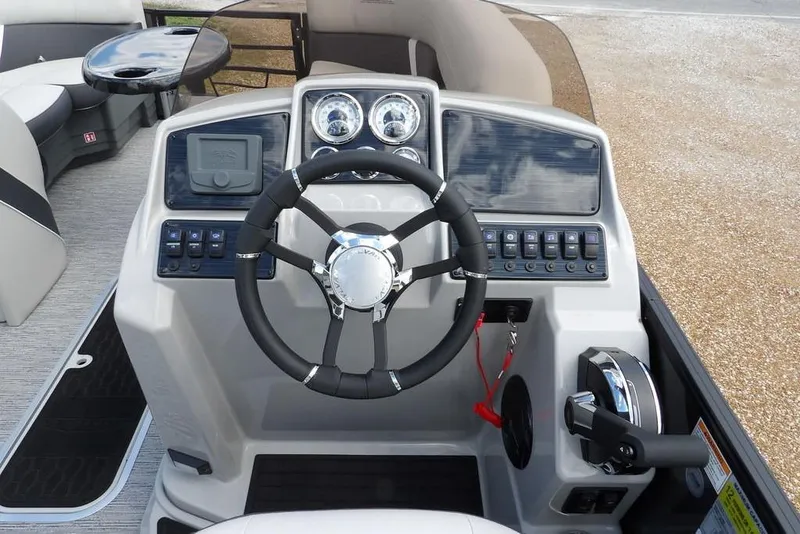 Slide: The Image of Steering console of 2026 Sylvan X3 CLZ DH boat with modern controls and gauges. - 22