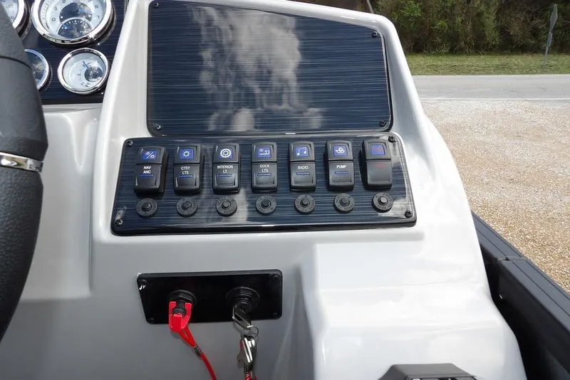 Slide: The Image of Control panel of 2026 Sylvan X3 CLZ DH boat with switches and gauges. - 26
