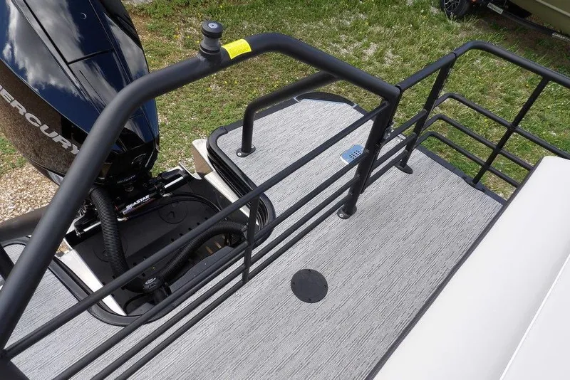 Slide: The Image of 2026 Sylvan X3 CLZ DH boat deck with railing and Mercury engine. - 37