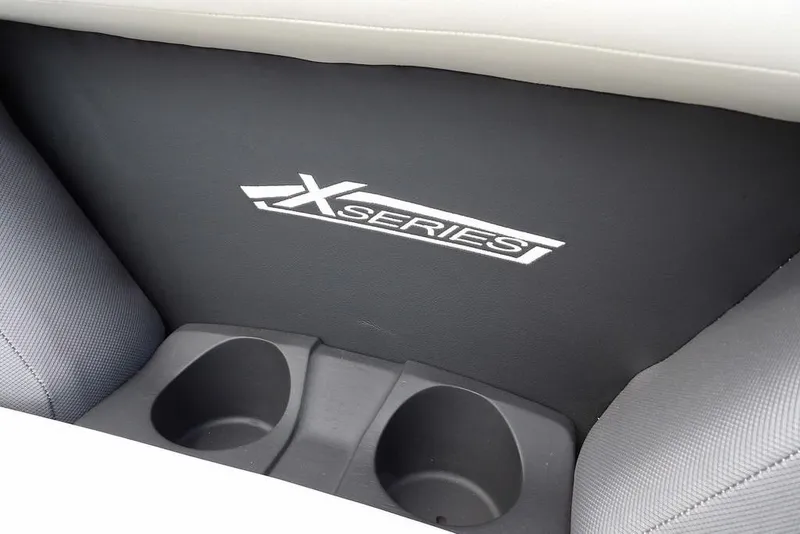 Slide: The Image of Interior of 2026 Sylvan X3 CLZ DH with "X Series" logo and cup holders. - 38