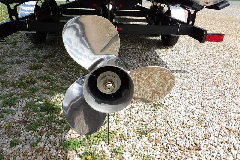 Slide: The Image of Propeller of 2026 Sylvan X3 CLZ DH boat on gravel surface. - 41