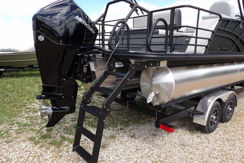 Slide: The Image of 2026 Sylvan X3 CLZ DH pontoon boat with Mercury outboard engine on trailer. - 43