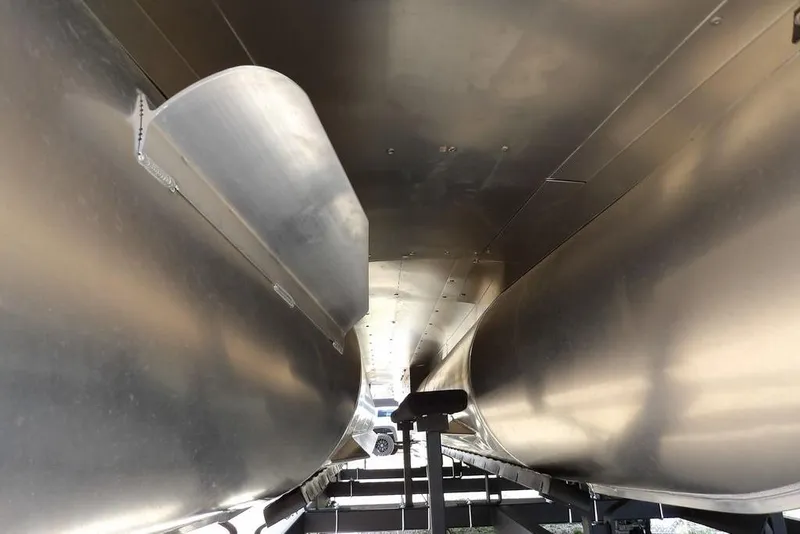 Slide: The Image of Underneath view of 2026 Sylvan X3 CLZ DH pontoon boat, showcasing aluminum pontoons. - 50