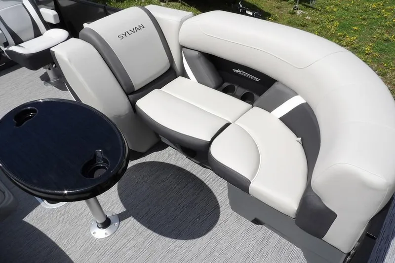 Slide: The Image of Luxurious seating on 2026 Sylvan X3 CLZ DH pontoon boat with sleek table design. - 7