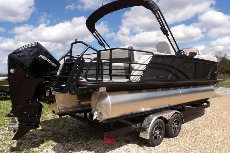 Slide: The Image of 2026 Sylvan X3 CLZ DH pontoon boat with Mercury engine on trailer. - 9