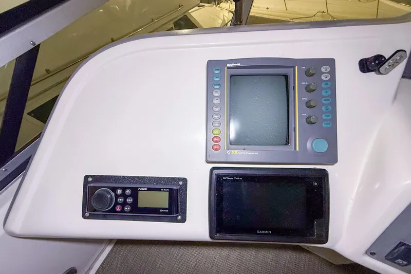 Slide: The Image of Control panel of a 1995 Sea Ray 370 Sedan Bridge with navigation and audio systems. - 30
