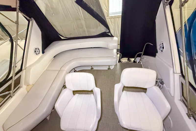 Slide: The Image of Interior of 1995 Sea Ray 370 Sedan Bridge with white seating and modern design. - 33