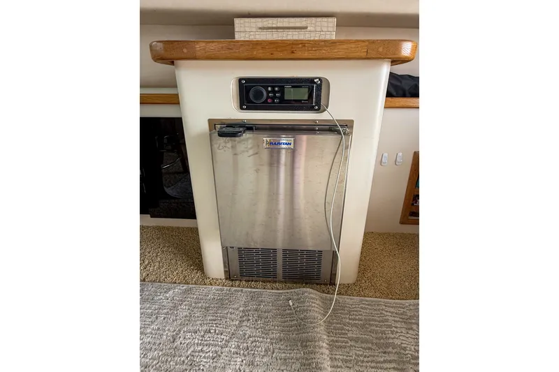 Slide: The Image of Built-in refrigerator on 1995 Sea Ray 370 Sedan Bridge yacht interior. - 12